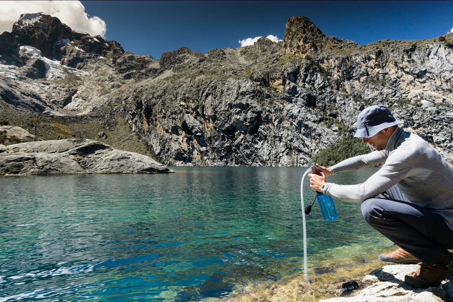 man collecting water from spring — citizen science